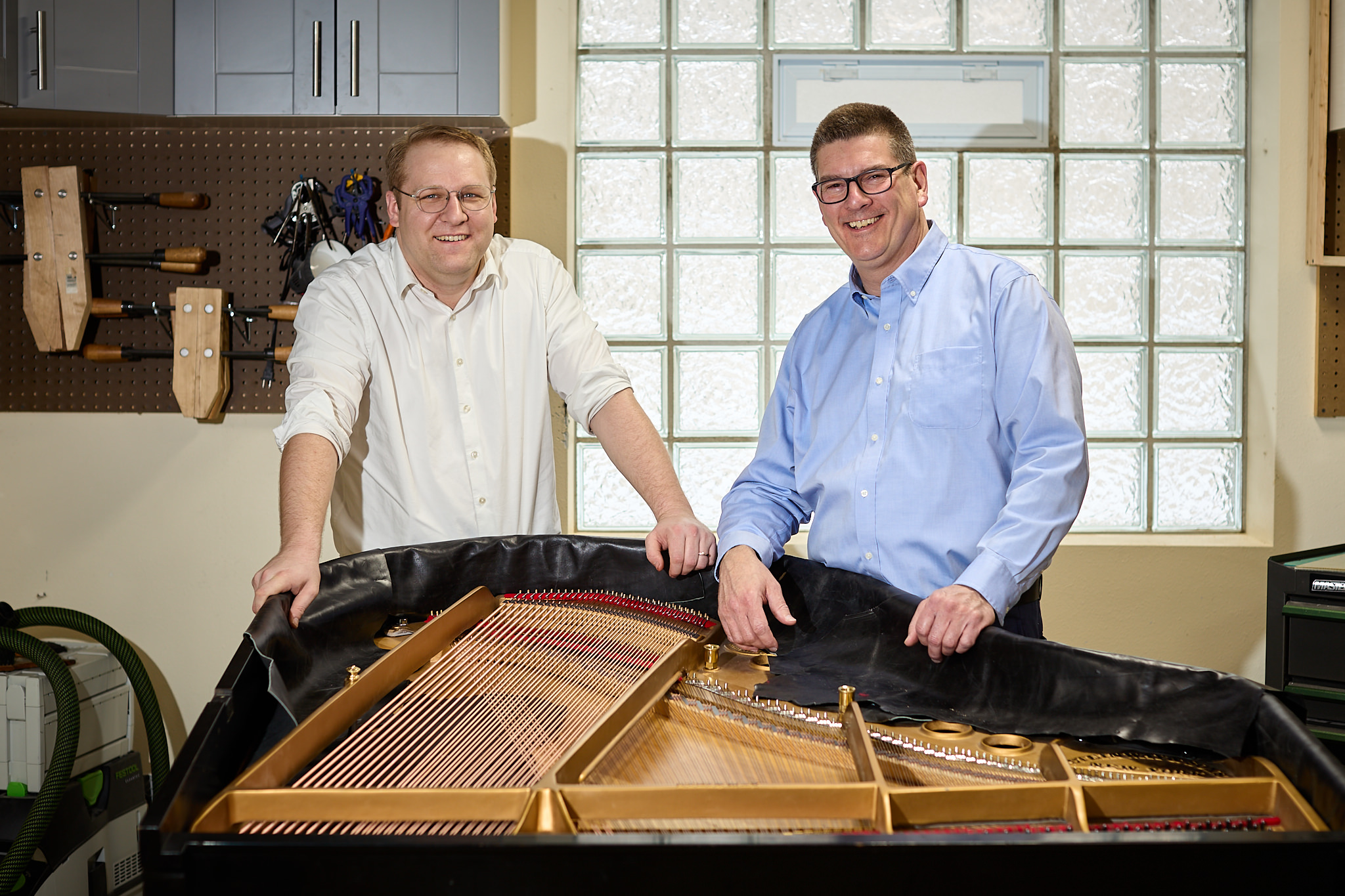 Piano techs, Dave and Tom in the workshop