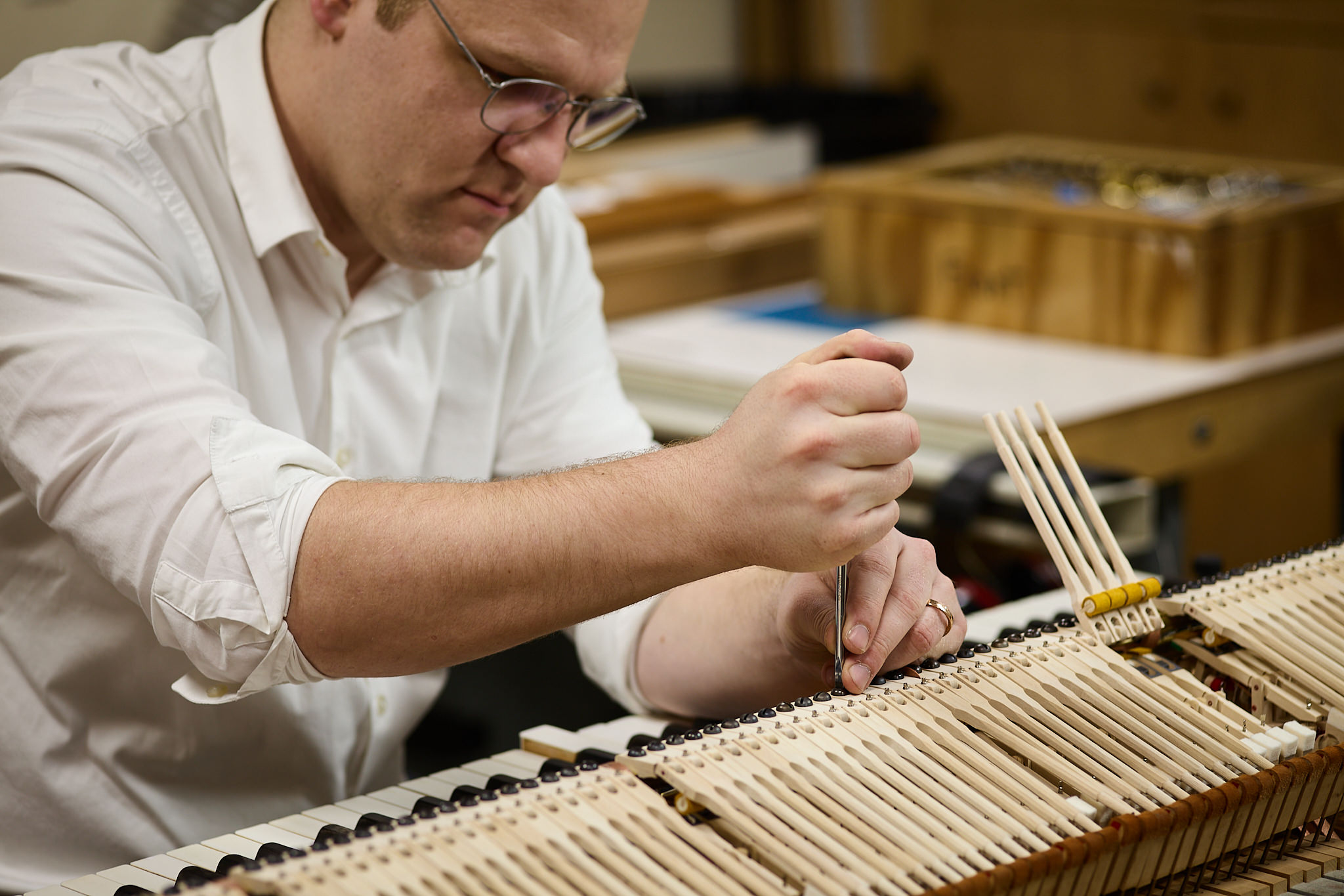 Piano tech, Tom working on piano action balancing