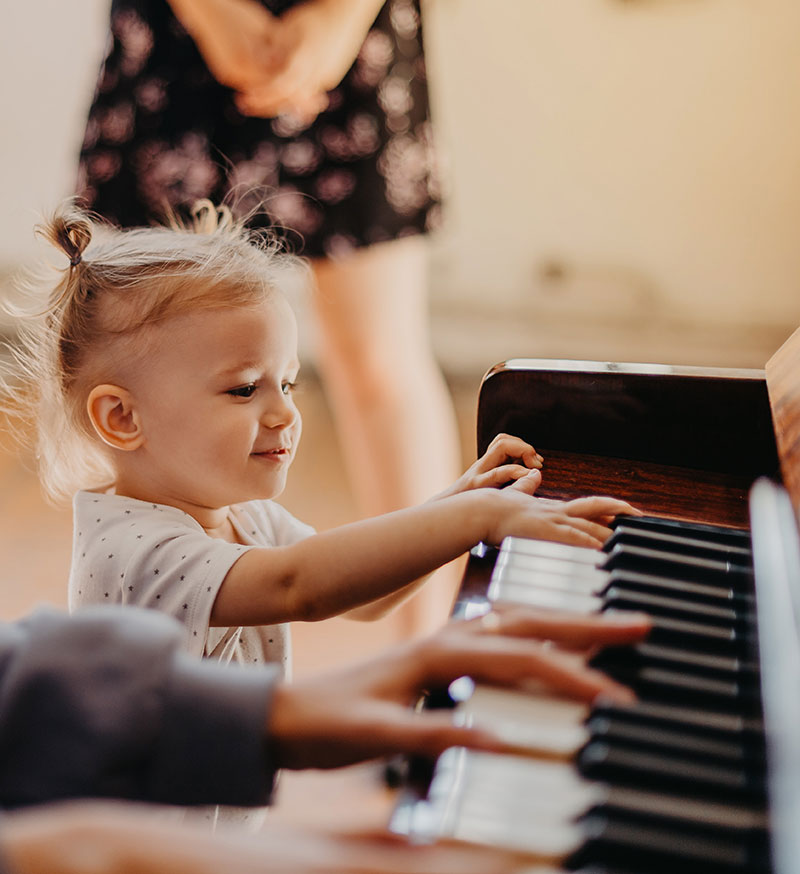 Young child getting started learning piano