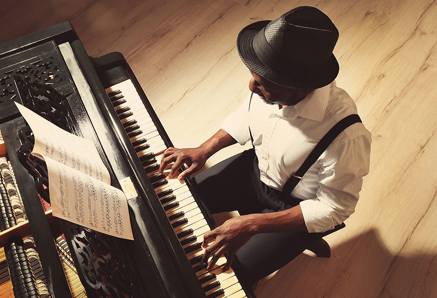 Professional player performing on a tuned piano