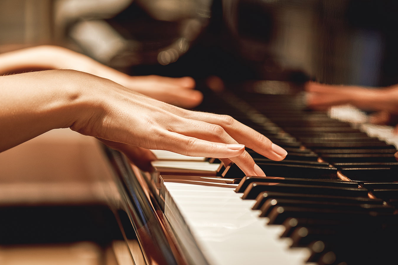 Close-up of piano players hands after action balancing service