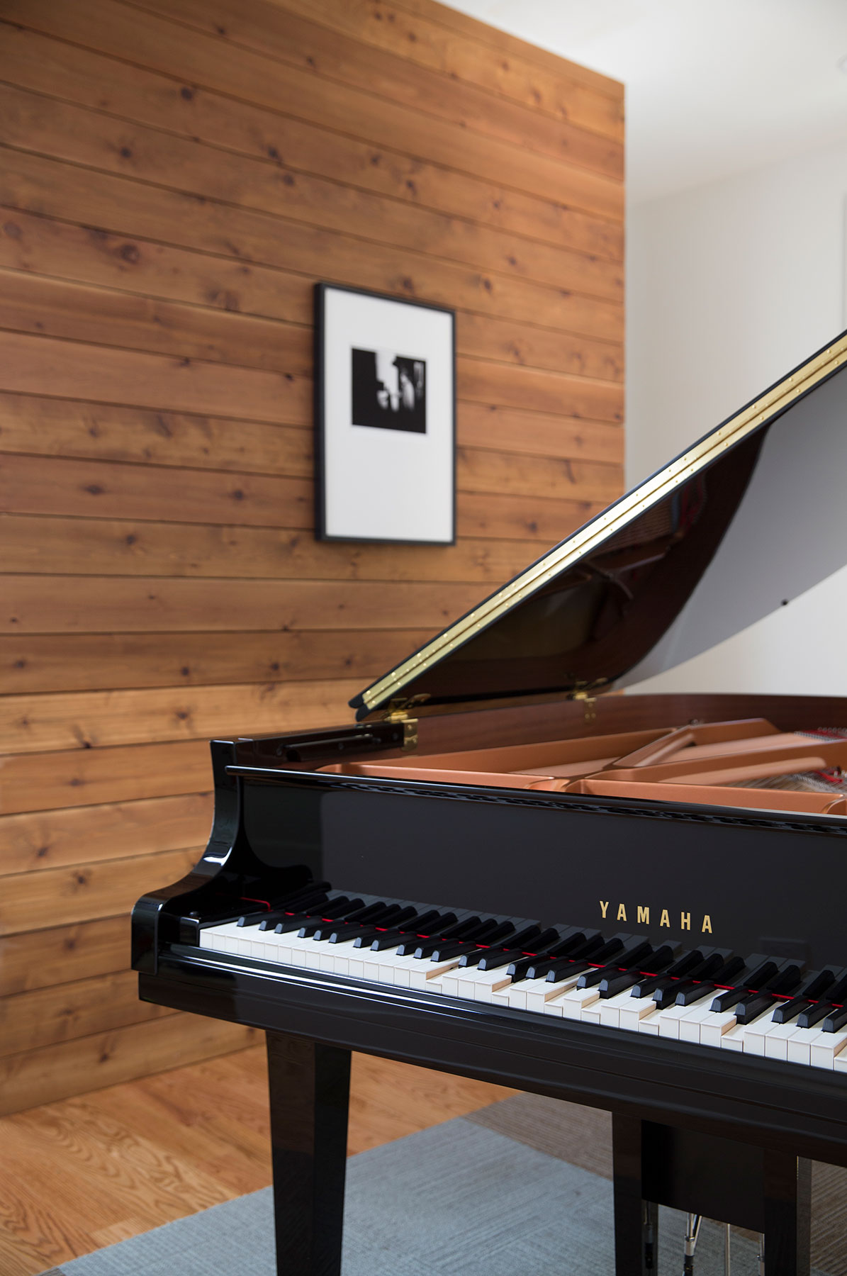 Cropped view of Yamaha baby grand piano in an apartment
