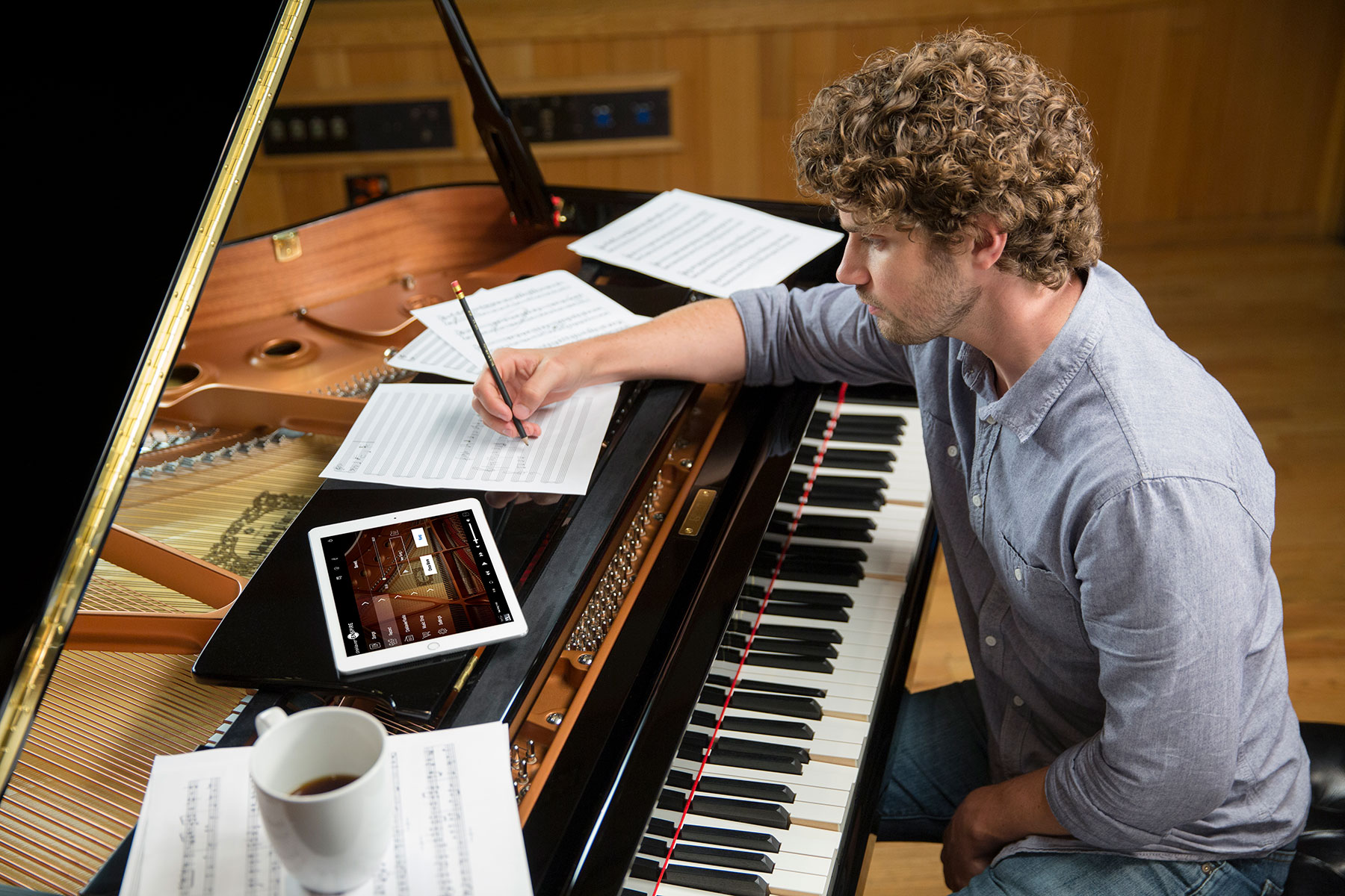 Musician writing a song at his piano