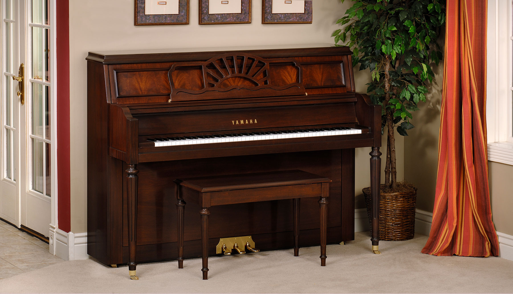 Yamaha upright piano with mahogany finish in a home